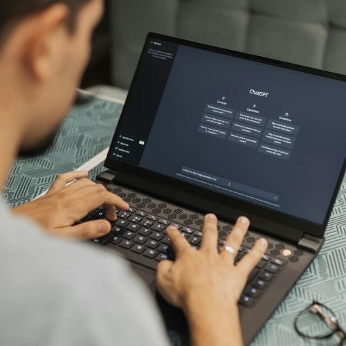 Business owner reviewing a ChatGPT advertisement opportunity with a digital marketer. – Elite Solutions Digital Marketing Agency